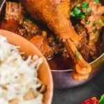 Flavorful chicken curry with rice and herbs